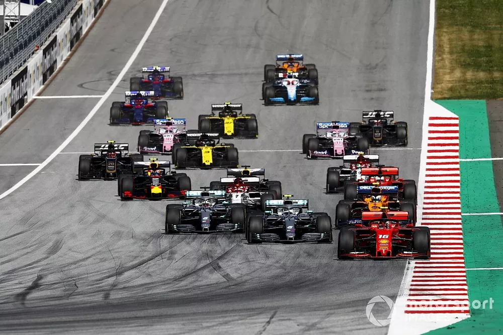 Charles Leclerc, Ferrari SF90 leads Valtteri Bottas, Mercedes AMG W10, Lewis Hamilton, Mercedes AMG F1 W10 and Lando Norris, McLaren MCL34 at the start of the race 