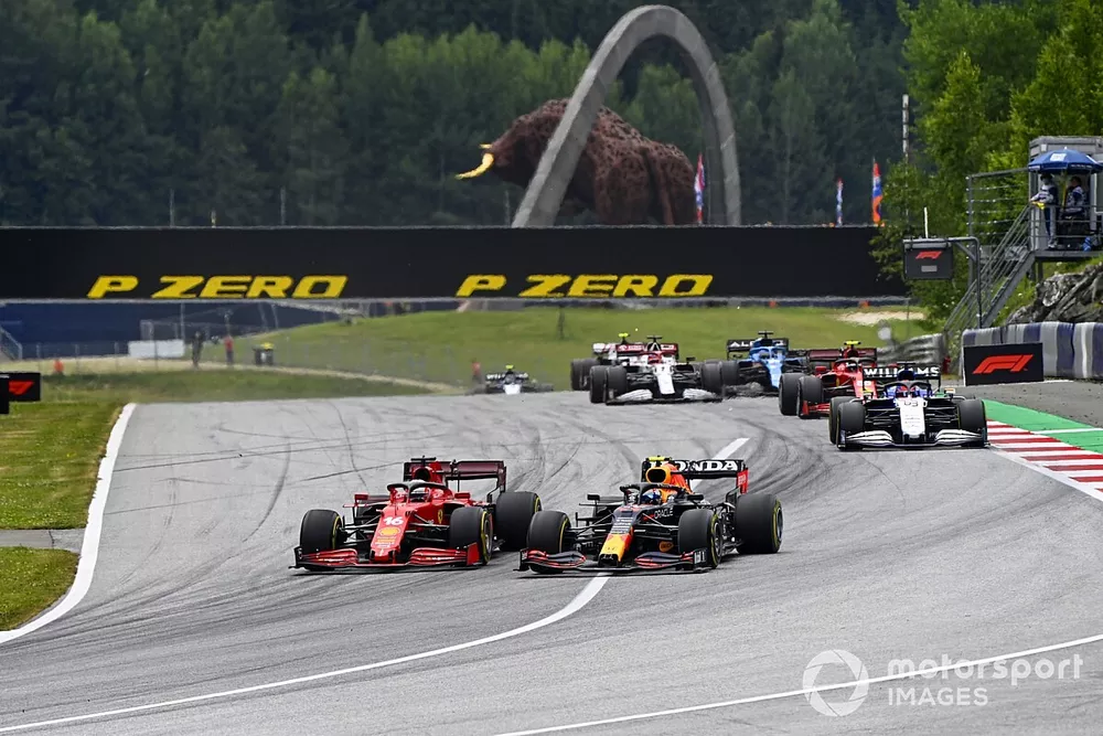 Sergio Perez, Red Bull Racing RB16B, battles with Charles Leclerc, Ferrari SF21