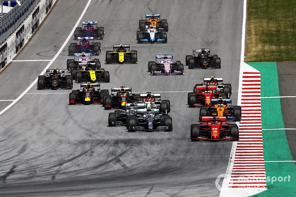 Charles Leclerc, Ferrari SF90, leads Valtteri Bottas, Mercedes AMG W10, Lewis Hamilton, Mercedes AMG F1 W10, Lando Norris, McLaren MCL34, Kimi Raikkonen, Alfa Romeo Racing C38, Sebastian Vettel, Ferrari SF90, Max Verstappen, Red Bull Racing RB15, and the rest of the field at the start