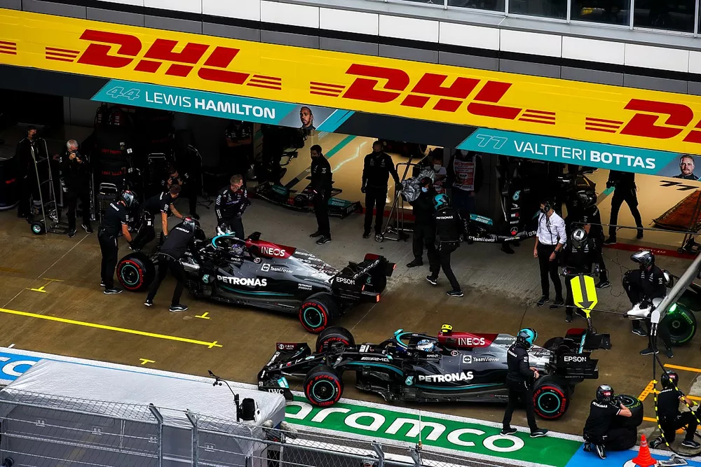 Lewis Hamilton, Mercedes W12, and Valtteri Bottas, Mercedes W12, in the pit lane