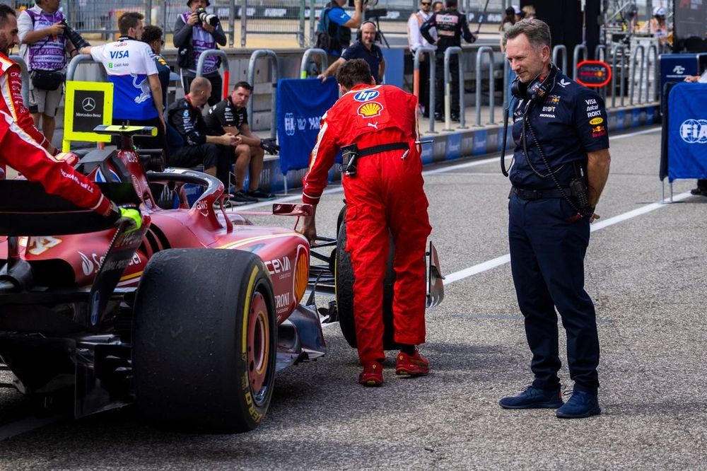 Christian Horner, Team Principal, Red Bull Racing, watches on as mechanics take the car of Carlos Sainz, Ferrari SF-24, out of Parc Ferme 
