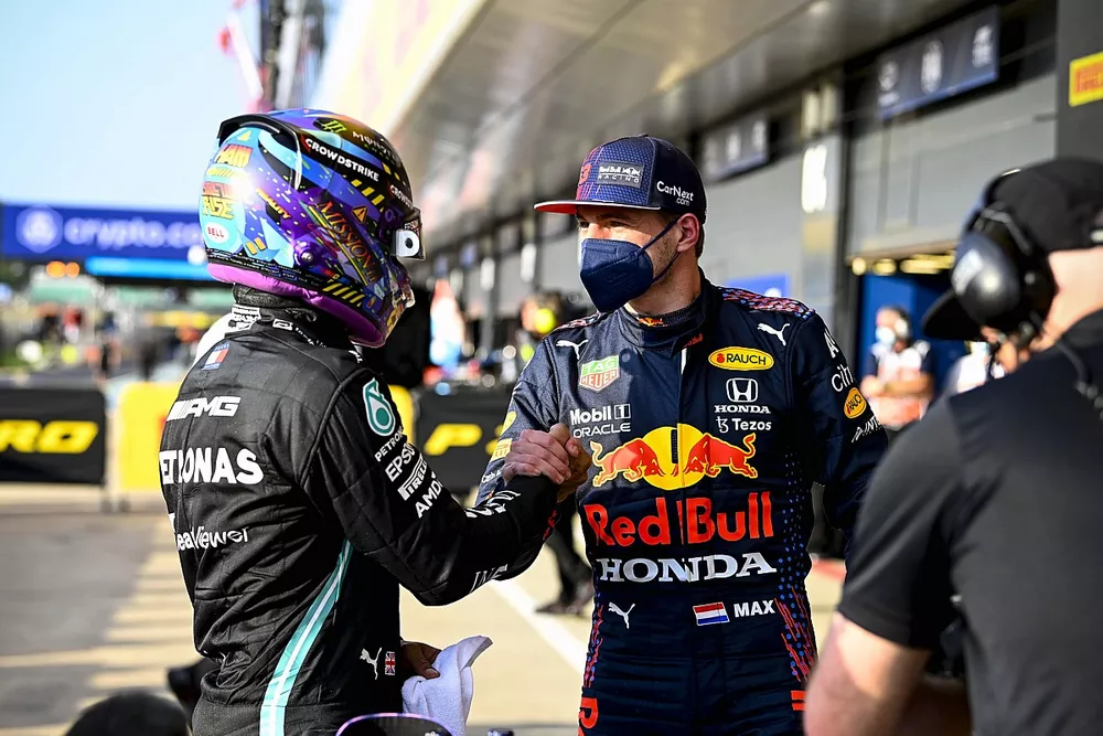 Pole man Lewis Hamilton, Mercedes, and Max Verstappen, Red Bull Racing, talk in Parc Ferme