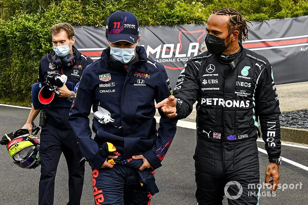 Sergio Perez, Red Bull Racing and Pole Sitter Lewis Hamilton, Mercedes walk to the Press Conference 