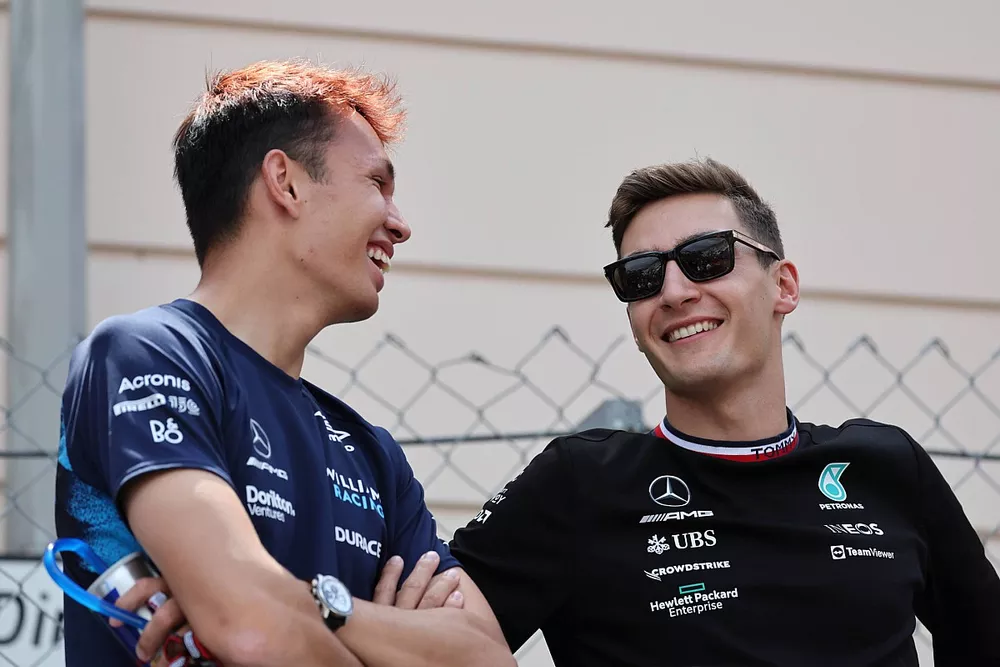 Alex Albon, Williams Racing, with George Russell, Mercedes-AMG