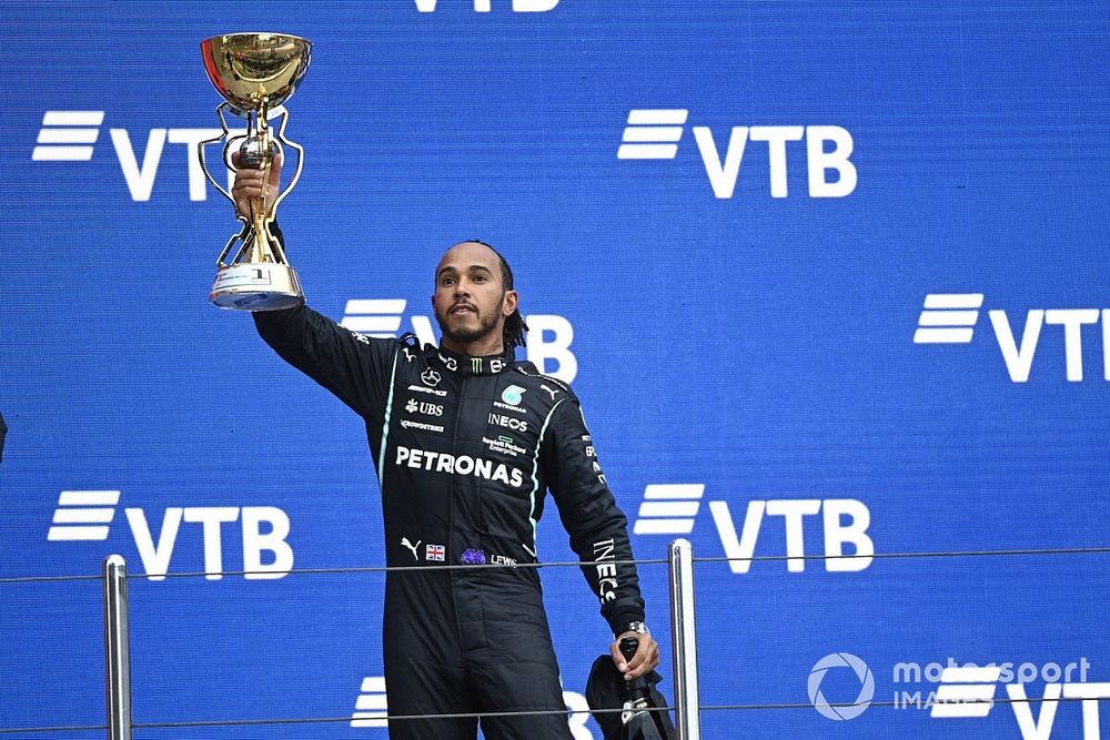 Lewis Hamilton, Mercedes, 1st position, lifts his trophy 