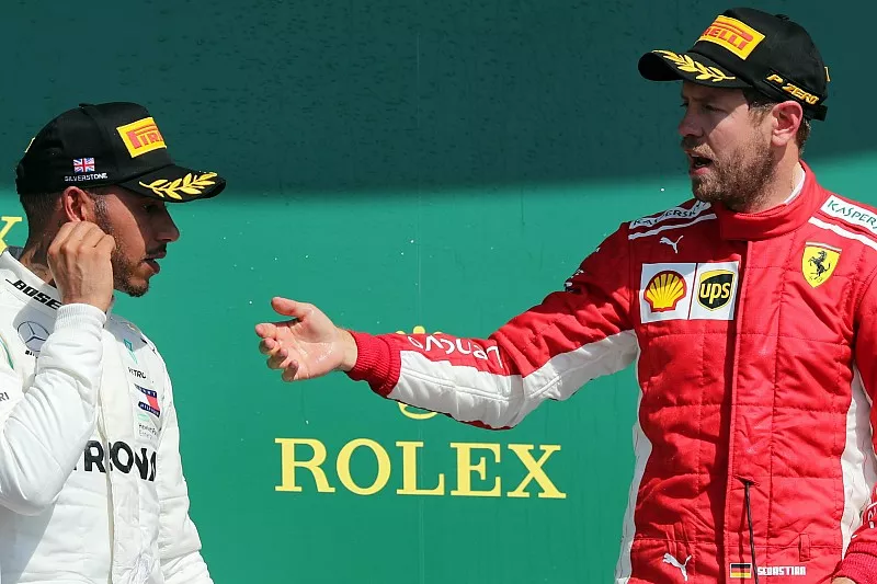 Sebastian Vettel, Ferrari and Lewis Hamilton, Mercedes AMG F1 on the podium