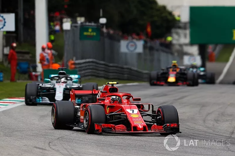 Kimi Raikkonen, Ferrari SF71H, leads Lewis Hamilton, Mercedes AMG F1 W09
