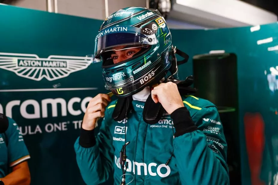 Lance Stroll, Aston Martin F1 Team, puts his helmet on
