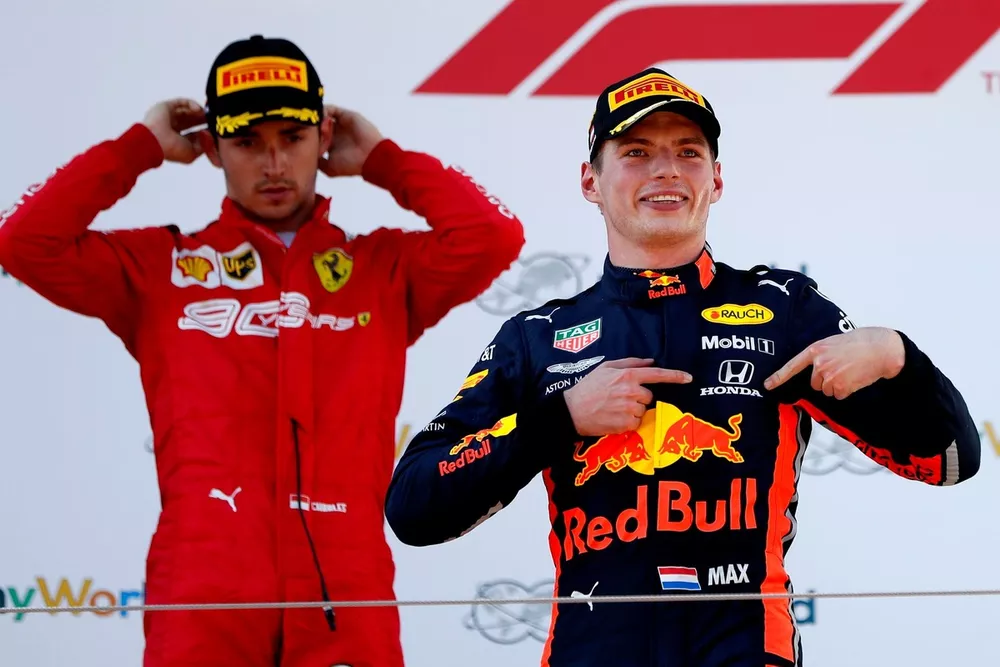 Race winner Max Verstappen, Red Bull Racing celebrates on the podium with Charles Leclerc, Ferrari