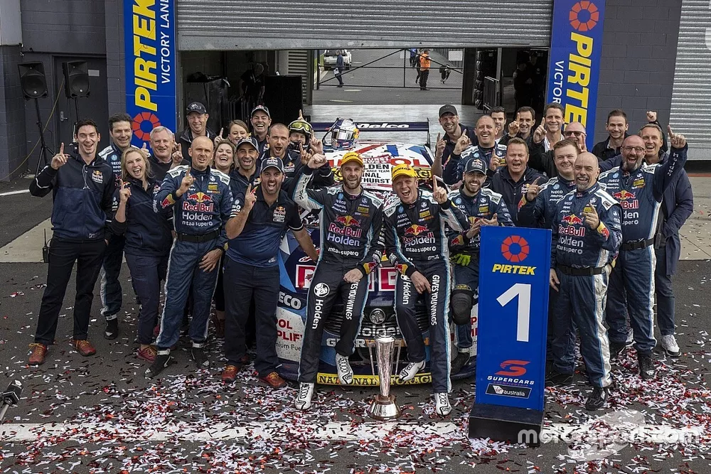 Race winners Shane van Gisbergen and Garth Tander celebrate with team