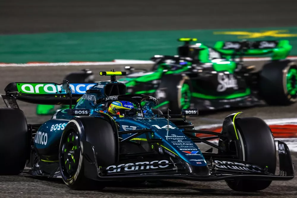 Fernando Alonso, Aston Martin AMR24, leads Zhou Guanyu, Stake F1 Team Kick Sauber C44