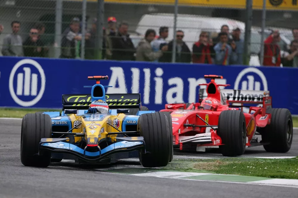 Fernando Alonso, Renault R25, leads Michael Schumacher, Ferrari F2005