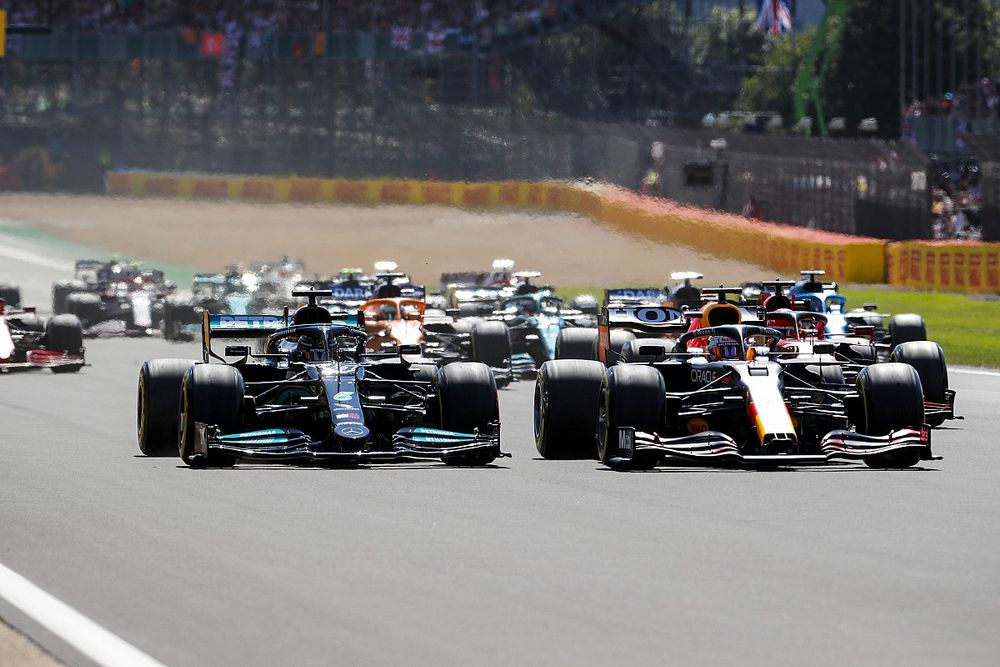 Max Verstappen, Red Bull Racing RB16B leads Lewis Hamilton, Mercedes W12 at the start of the race

