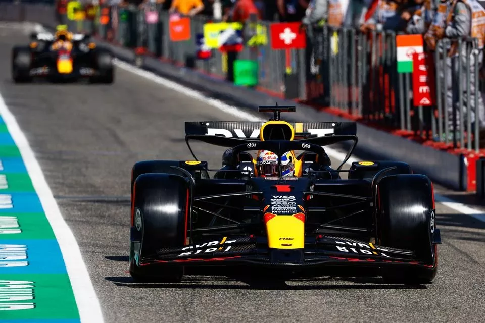 Max Verstappen, Red Bull Racing RB20, in the pit lane