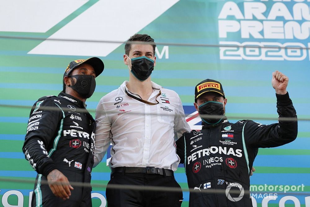 Lewis Hamilton, Mercedes-AMG Petronas F1, 1st position, and Valtteri Bottas, Mercedes-AMG Petronas F1, 3rd position, on the podium with the Mercedes trophy delegate