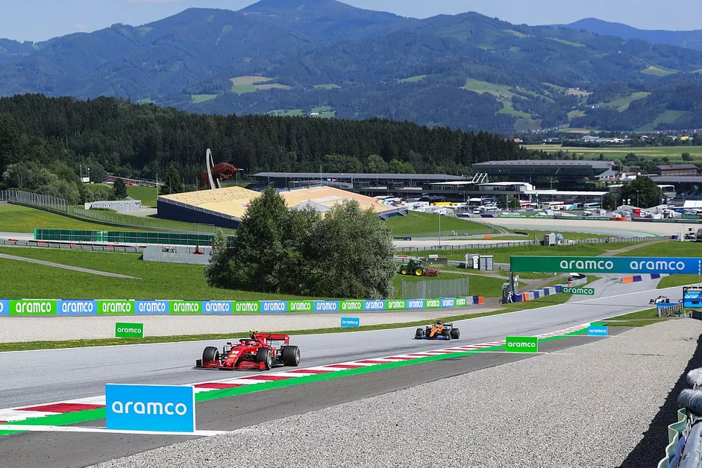 Charles Leclerc, Ferrari SF1000, leads Carlos Sainz Jr., McLaren MCL35