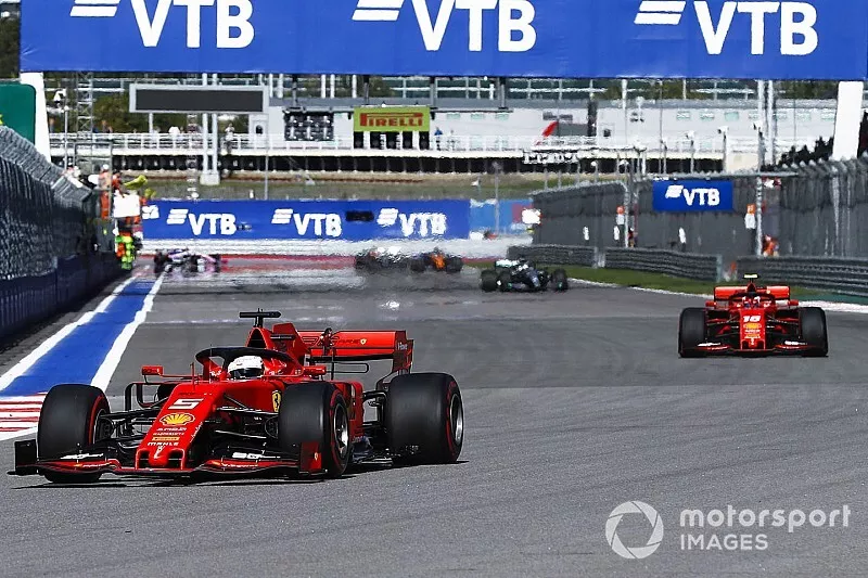Sebastian Vettel, Ferrari SF90, leads Charles Leclerc, Ferrari SF90