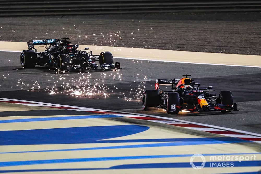 Sparks fly as Max Verstappen, Red Bull Racing RB16, George Russell, Mercedes F1 W11