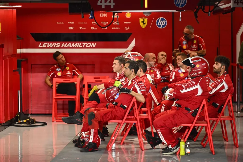The Ferrari pit crew in the garage