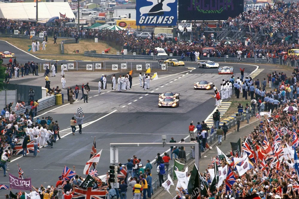 The winning #2 Jaguar XJR-9: Andy Wallace, Johnny Dumfries, Jan Lammers crosses the finish line