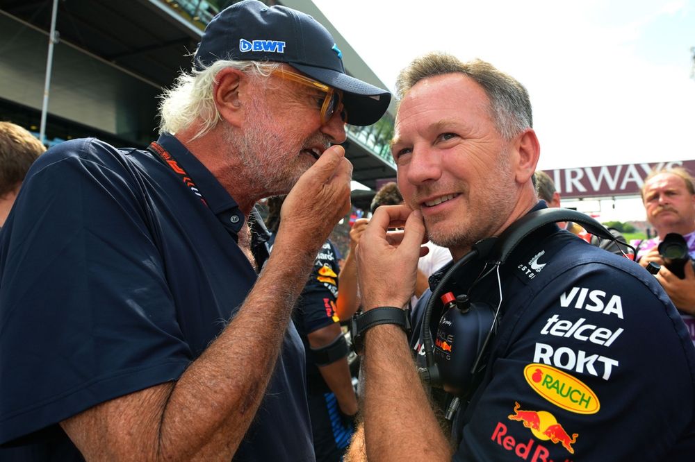 Flavio Briatore talks to Christian Horner, Team Principal, Red Bull Racing, on the grid
