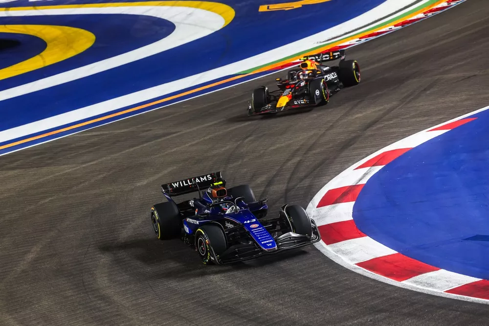 Franco Colapinto, Williams FW46, leads Sergio Perez, Red Bull Racing RB20