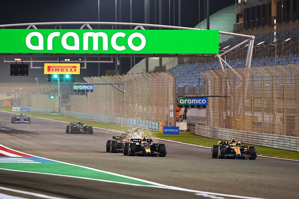 Lando Norris, McLaren MCL60, Sergio Perez, Red Bull Racing RB19, followed by Valtteri Bottas, Alfa Romeo C43, during a practice start