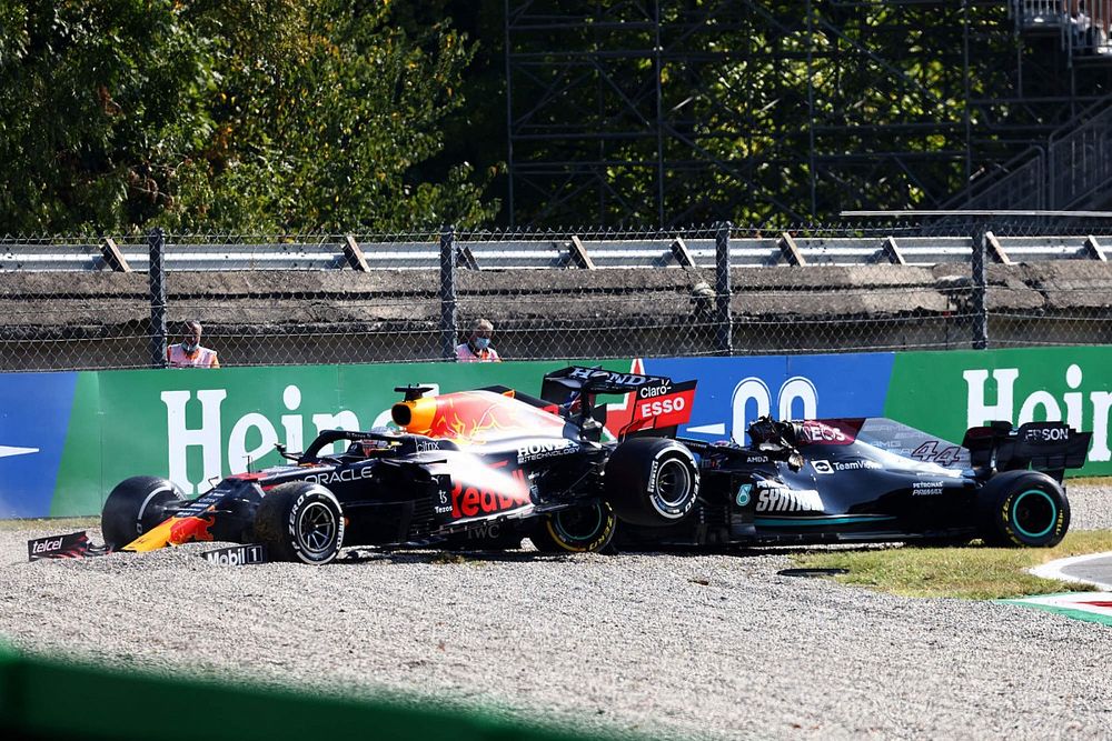 Max Verstappen, Red Bull Racing RB16B, and Lewis Hamilton, Mercedes W12, collide whilst battling for position