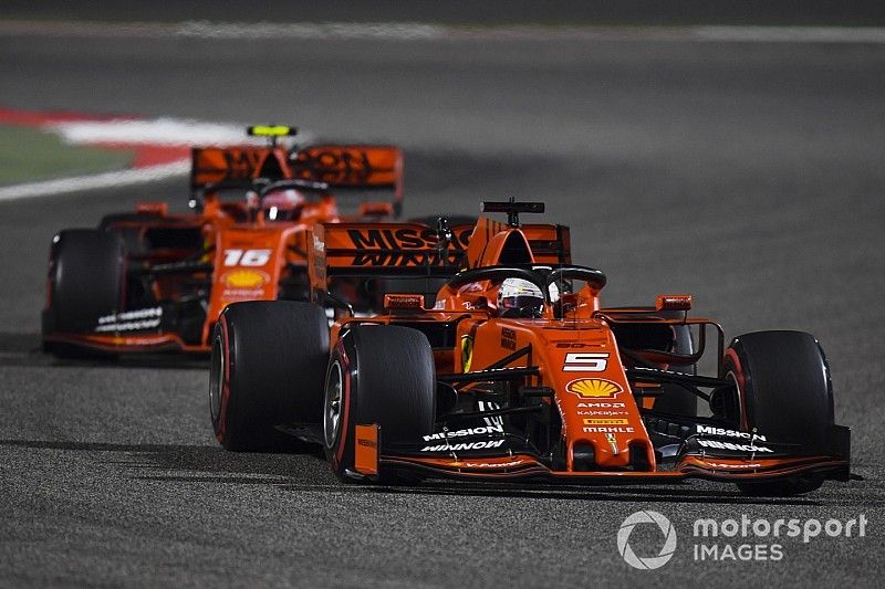 Sebastian Vettel, Ferrari SF90, leads Charles Leclerc, Ferrari SF90