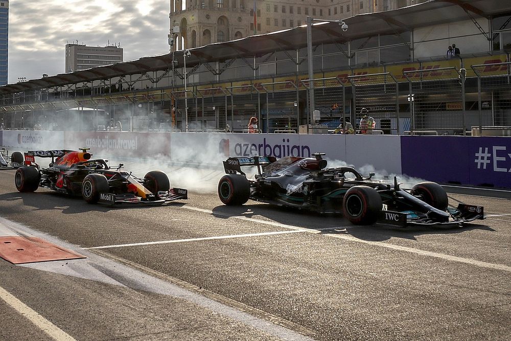 Lewis Hamilton, Mercedes W12 and Sergio Perez, Red Bull Racing RB16B at the restart