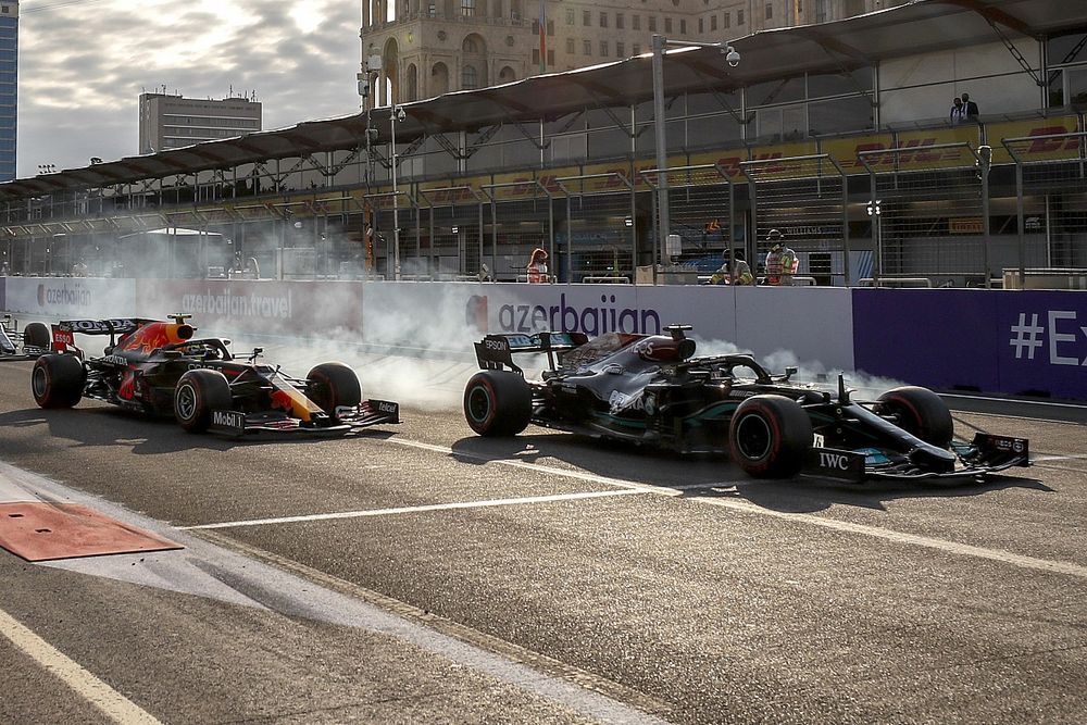 Lewis Hamilton, Mercedes W12 and Sergio Perez, Red Bull Racing RB16B at the restart  