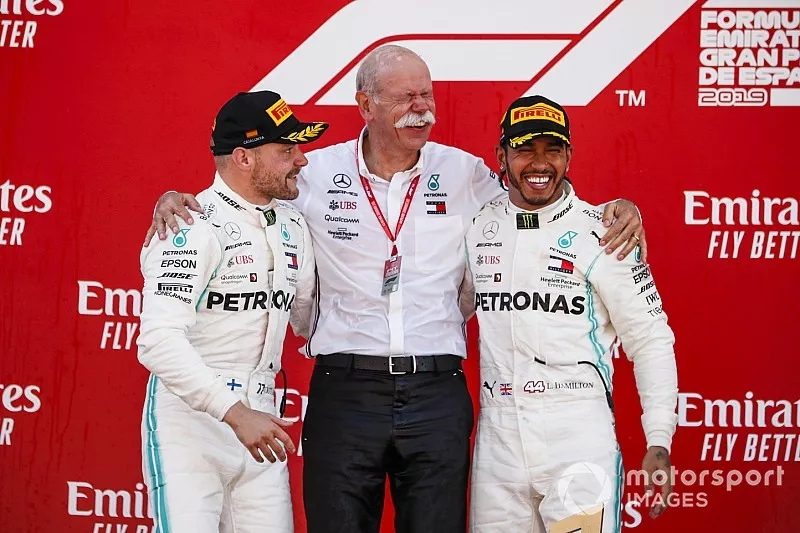 Valtteri Bottas, Mercedes AMG F1, 2nd position, Dr Dieter Zetsche, CEO, Mercedes Benz, and Lewis Hamilton, Mercedes AMG F1, 1st position, on the podium