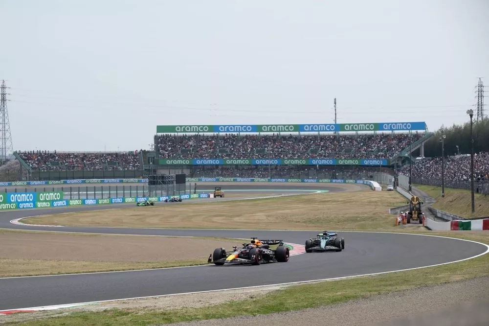 Max Verstappen, Red Bull Racing RB20, ahead of Lance Stroll, Aston Martin AMR24 