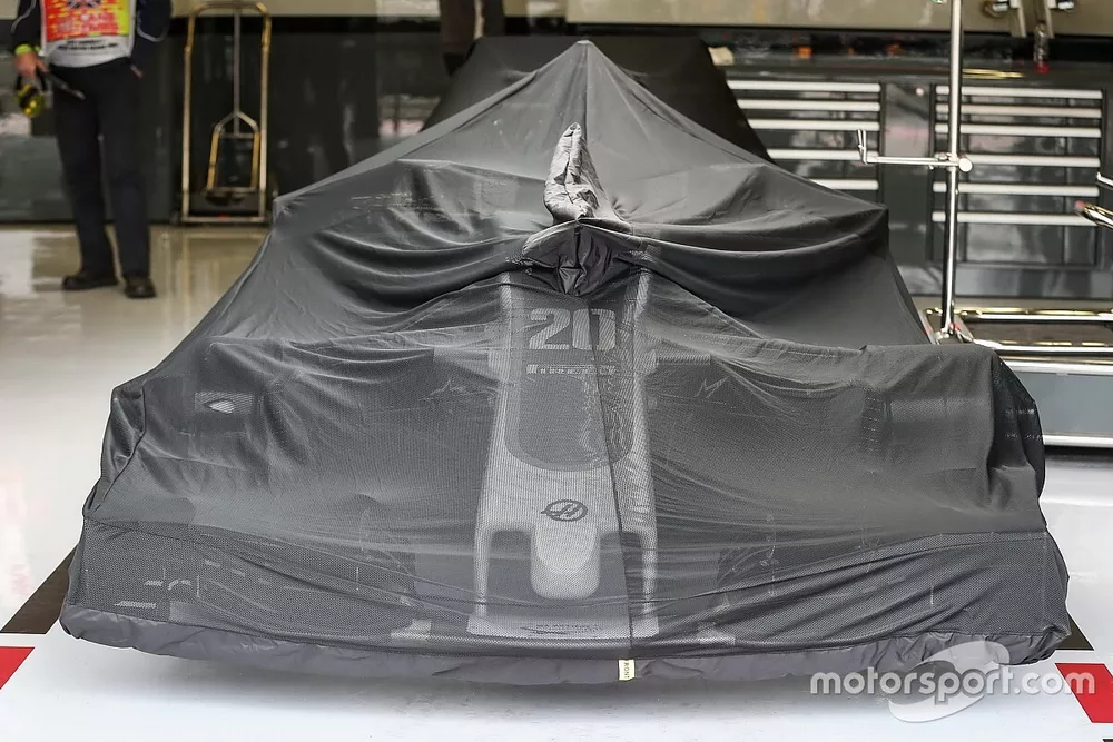 Haas F1 Team VF-17 under covers in the garage