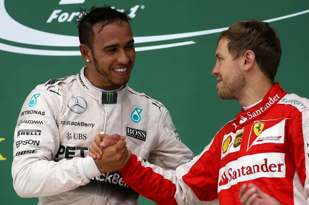 Lewis Hamilton, Nercedes is congratulated by Sebastian Vettel, Ferrari  after clinching his third world title