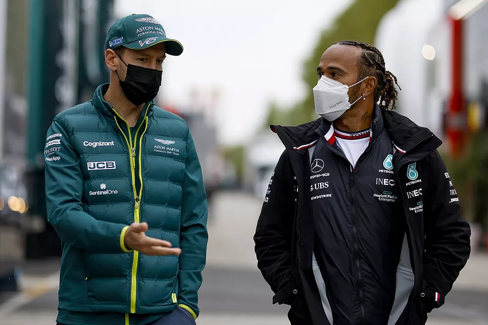 Sebastian Vettel, Aston Martin with Lewis Hamilton, Mercedes
