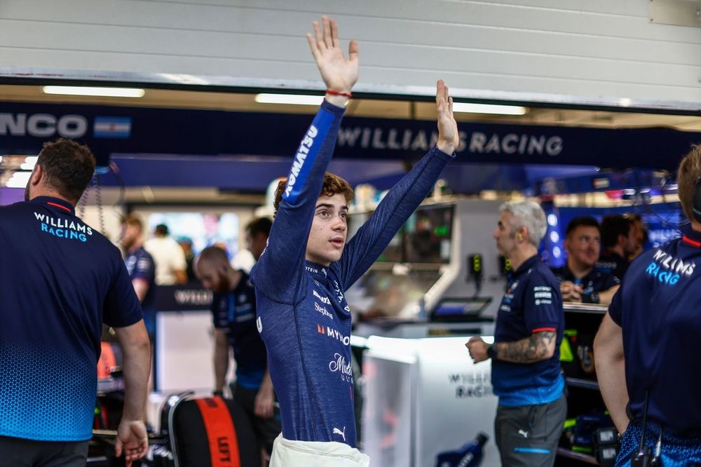 Franco Colapinto, Williams Racing, waves to fans from the pit lane