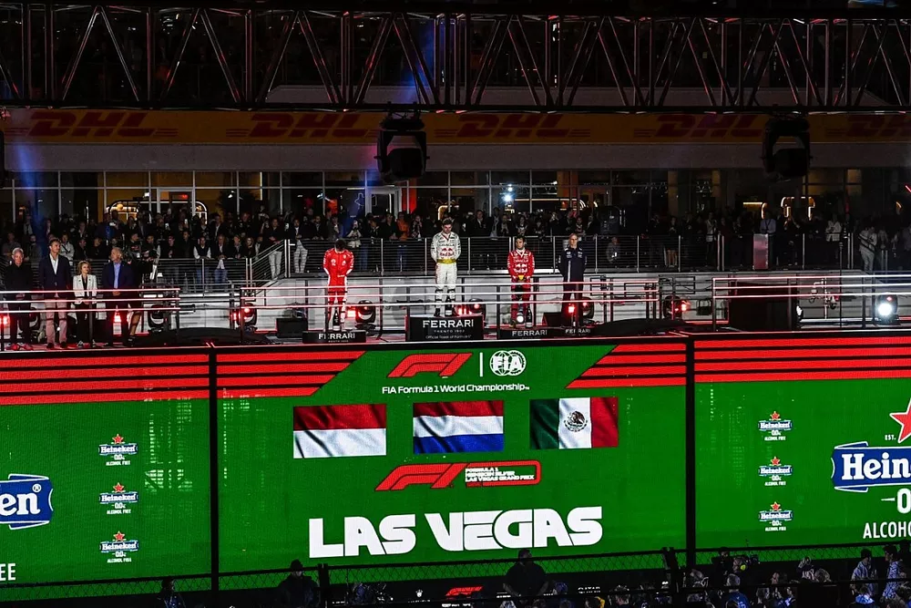 Charles Leclerc, Scuderia Ferrari, 2nd position, Max Verstappen, Red Bull Racing, 1st position, Sergio Perez, Red Bull Racing, 3rd position, on the podium