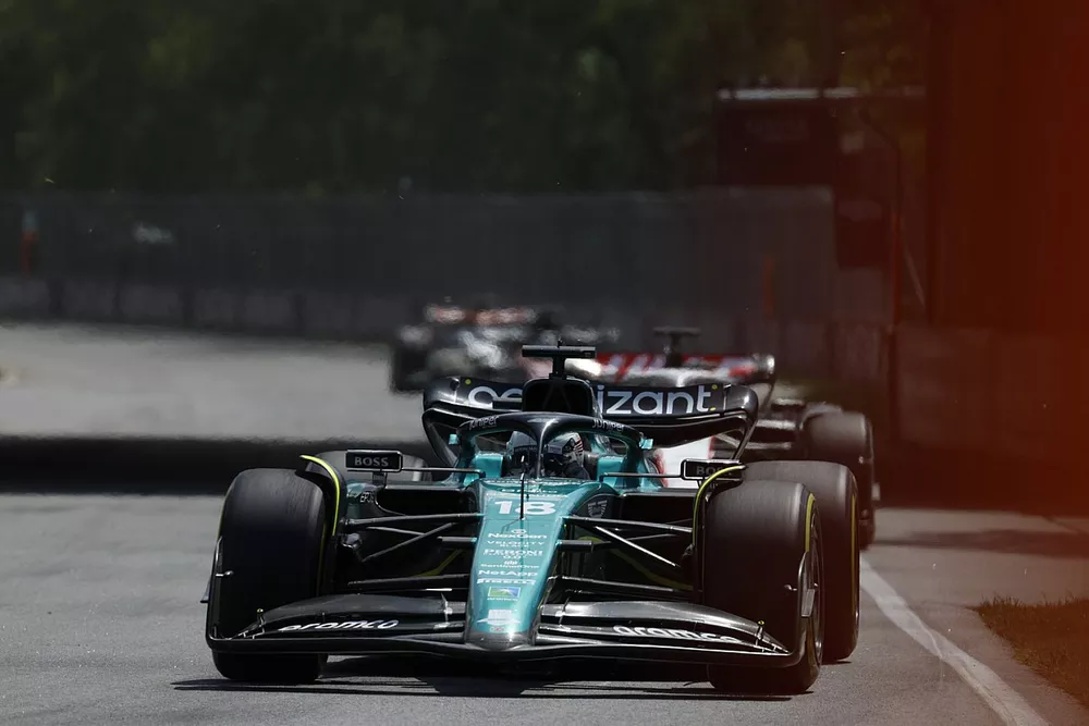 Lance Stroll, Aston Martin AMR23, Kevin Magnussen, Haas VF-23