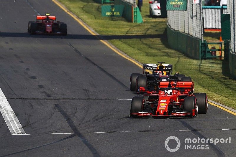 Sebastian Vettel, Ferrari SF90, leads Max Verstappen, Red Bull Racing RB15, and Charles Leclerc, Ferrari SF90