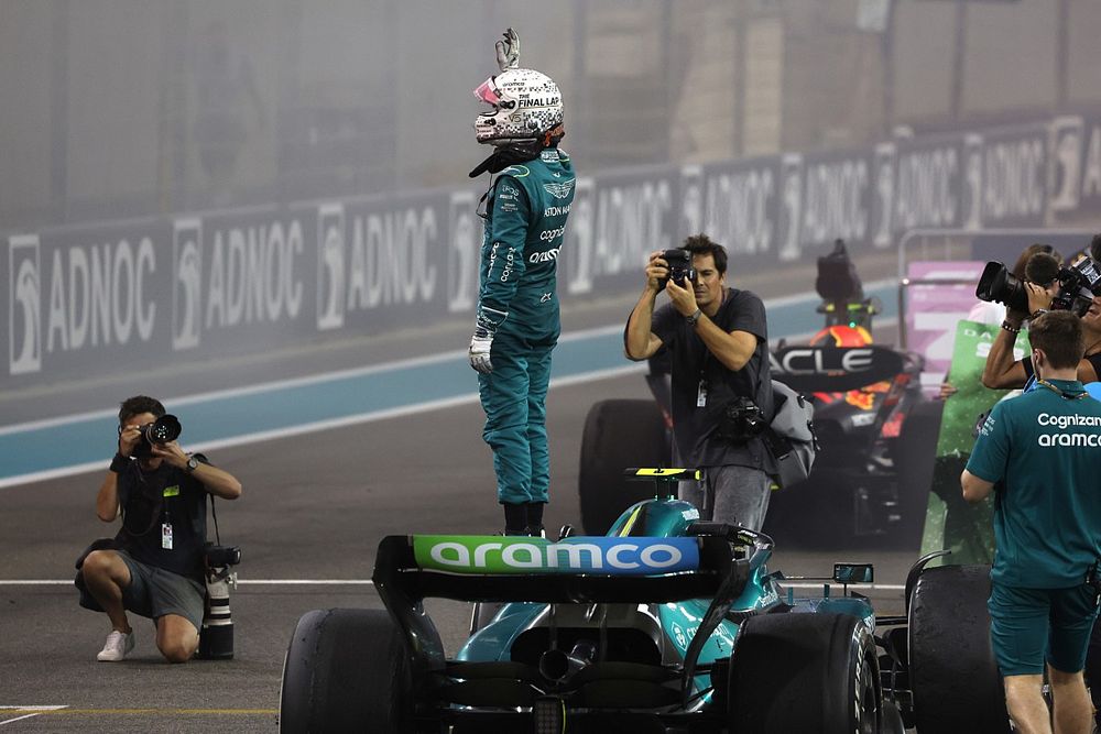 Sebastian Vettel, Aston Martin, waves to the fans from the grid after the end of his final race in F1