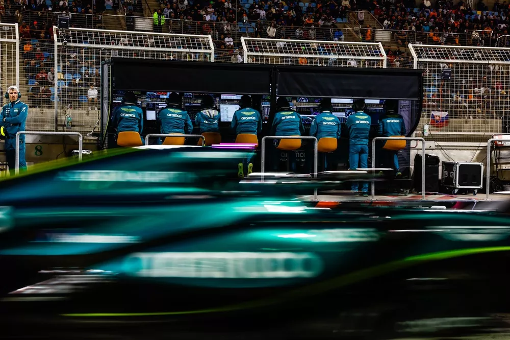 Lance Stroll, Aston Martin AMR24, passes engineers of the Aston Martin F1 Team on the pit wall