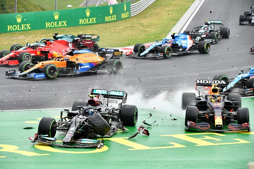 Valtteri Bottas, Mercedes W12, collides with Sergio Perez, Red Bull Racing RB16B, at the start