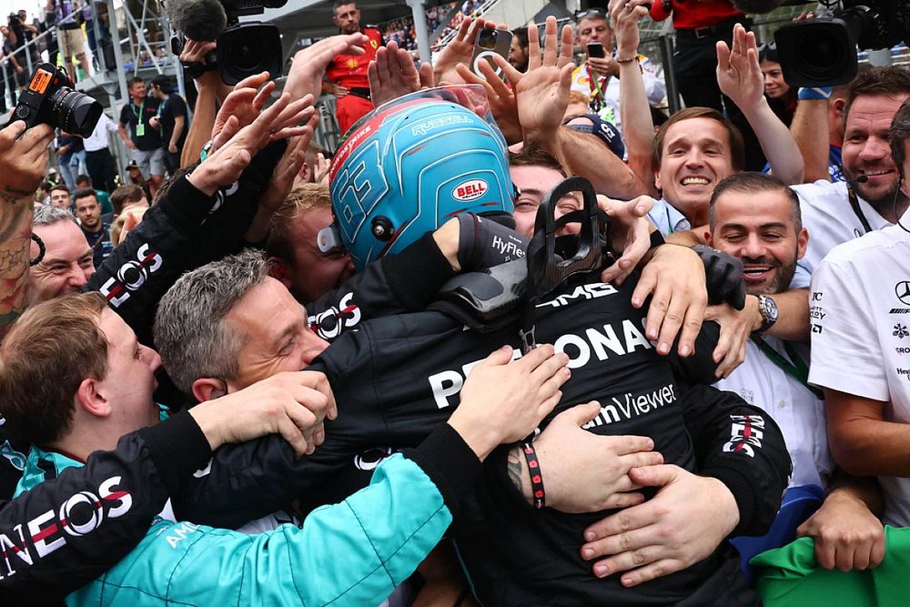 George Russell, Mercedes AMG, 1st position, celebrates with his team in Parc Ferme