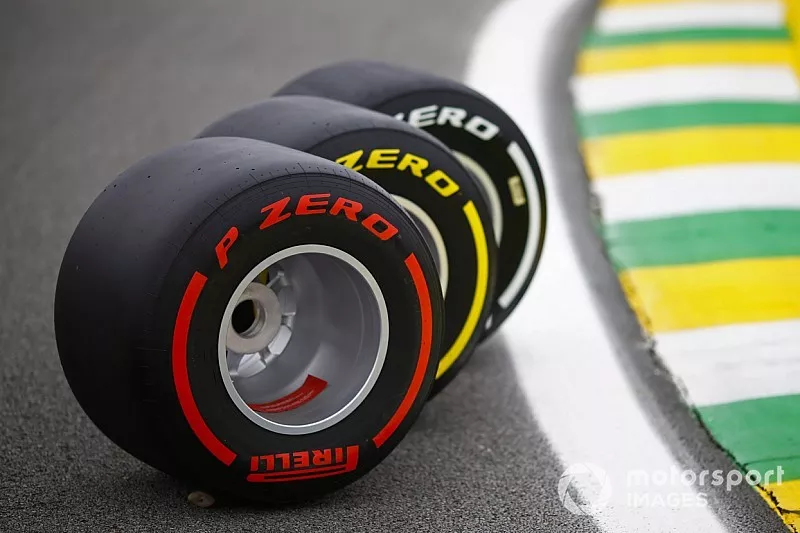 Three Pirelli tyres are displayed on the track