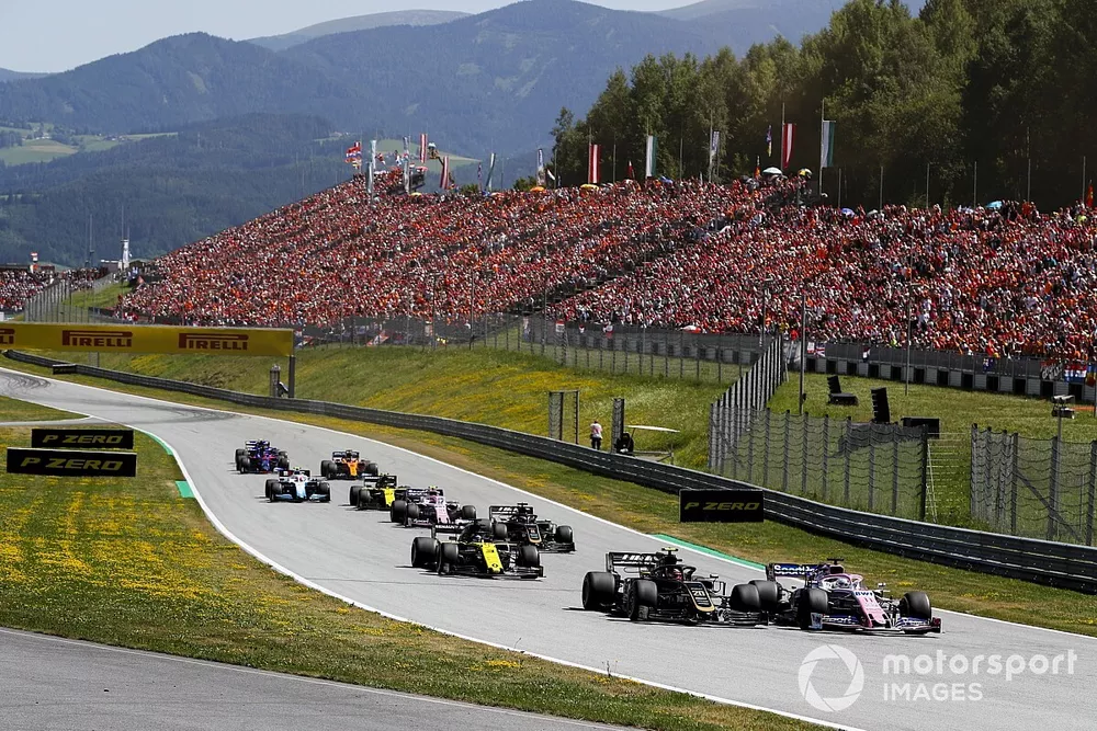 Sergio Perez, Racing Point RP19, leads Kevin Magnussen, Haas F1 Team VF-19, Daniel Ricciardo, Renault F1 Team R.S.19, Romain Grosjean, Haas F1 Team VF-19, Lance Stroll, Racing Point RP19, and the remainder of the field at the start