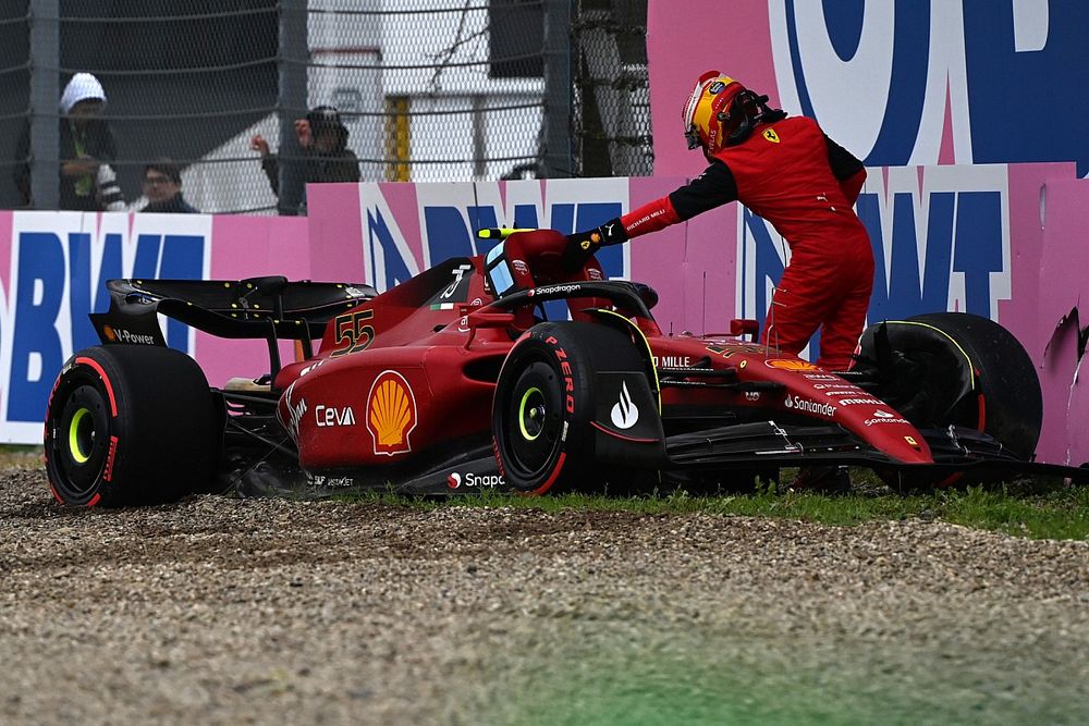 Carlos Sainz Jr., Ferrari F1-75, climbs out of his car after crashing out in Q2