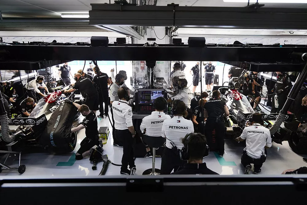 The Mercedes team at work in the garage
