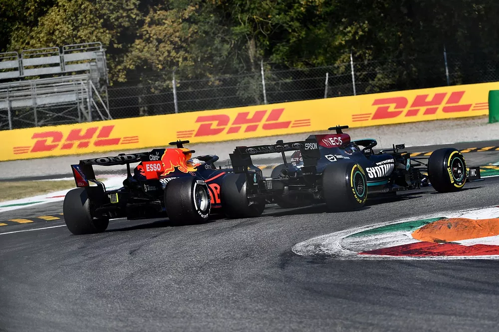 Max Verstappen, Red Bull Racing RB16B, and Lewis Hamilton, Mercedes W12, collide