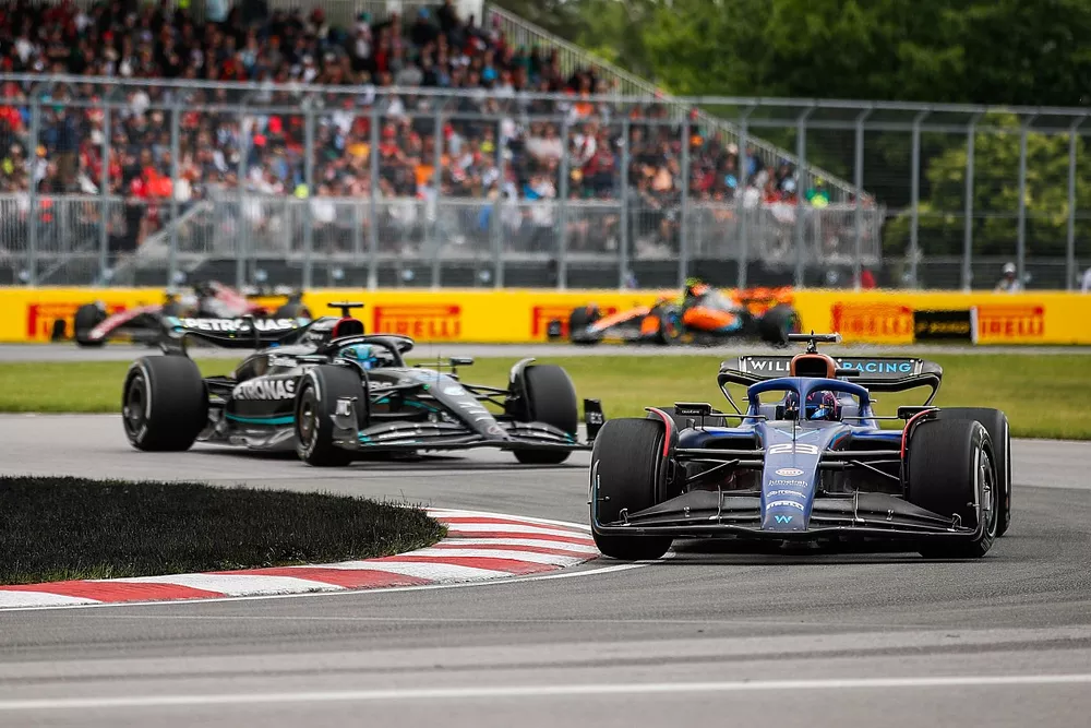 Alex Albon, Williams FW45, leads George Russell, Mercedes F1 W14